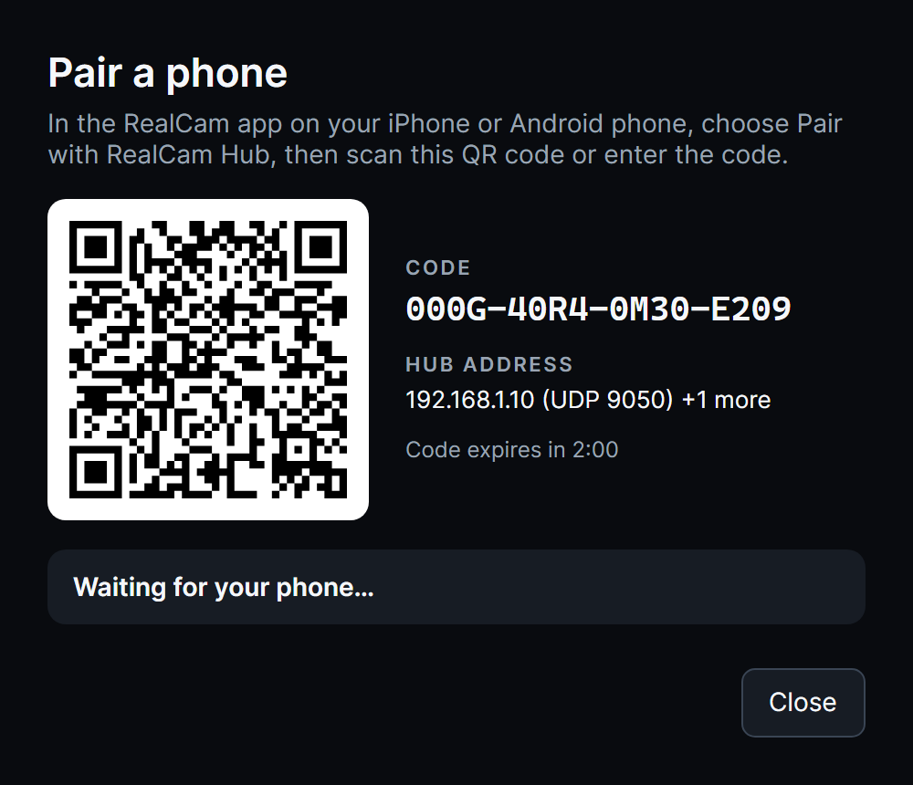 Pair a phone dialog in RealCam Hub with a QR code and a pairing code